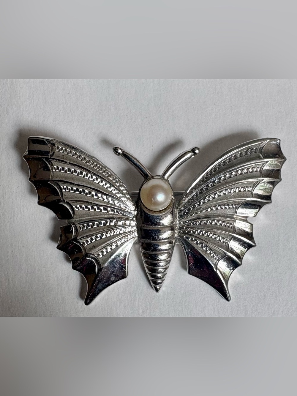 Vintage Sterling silver butterfly brooch with faux pearl and filigree wings